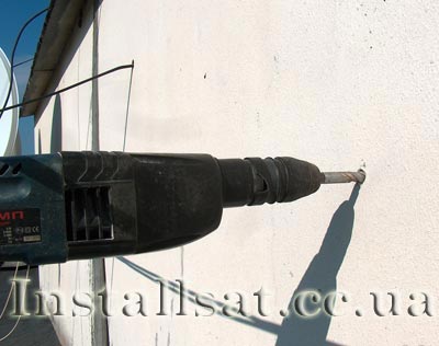 Drilling holes for attaching the satellite antenna bracket